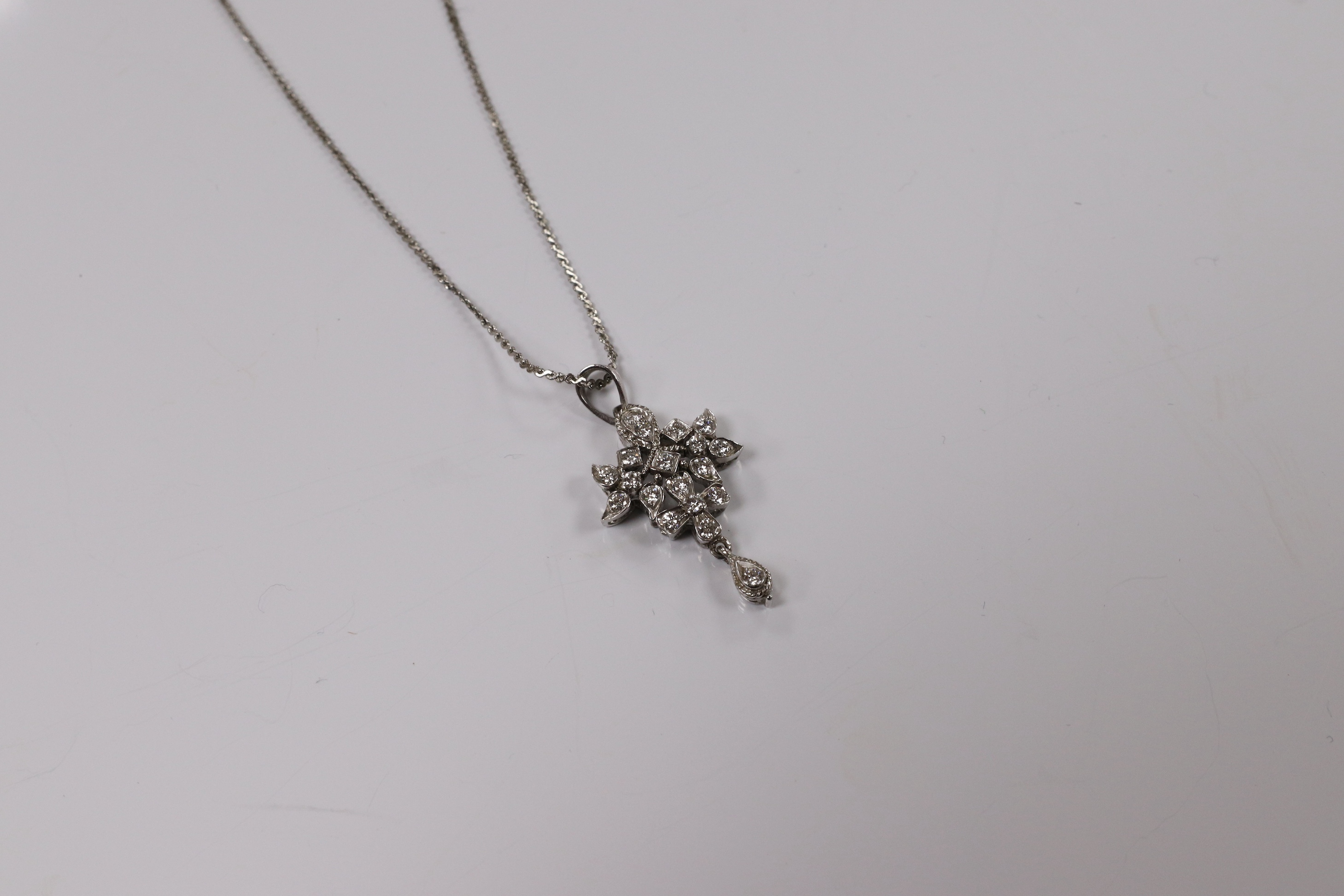 A modern white metal and diamond chip cluster set drop pendant, 33mm, on a base metal chain. Condition - fair